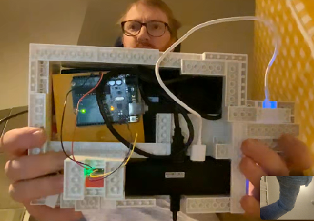 The vr handset from behind, showing cables and the Arduino as well as the mini PC